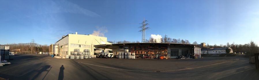 panoramic outdoor view of the humintech company site with loading gate and storage facilities
